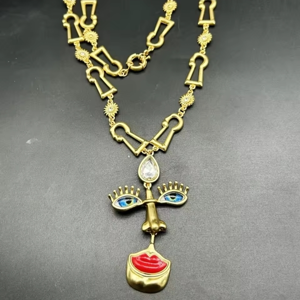 Gold-tone Abstract Face Pendant Necklace with Red Lips - Picture 4 of 5